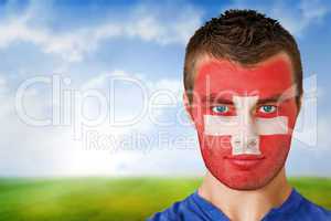 Swiss football fan in face paint