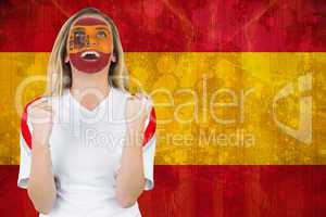 Excited spain fan in face paint cheering