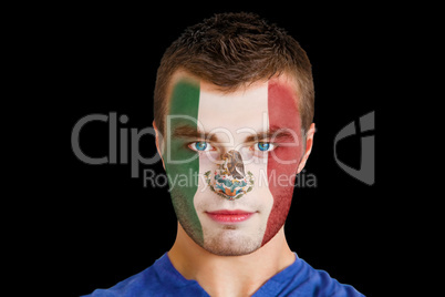 Serious young mexico fan with facepaint
