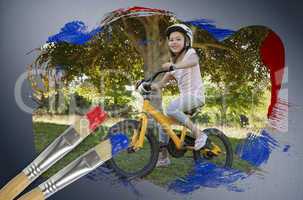 Composite image of little girl on a bike