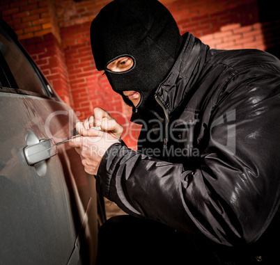 Car thief in a mask.
