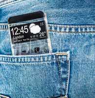 Smartphone with a transparent screen in a pocket of jeans.