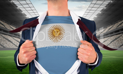 Businessman opening shirt to reveal argentina flag