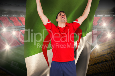 Excited football player cheering holding algeria flag