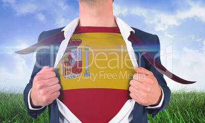 Businessman opening shirt to reveal spain flag