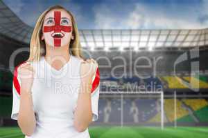 Excited fan england in face paint cheering