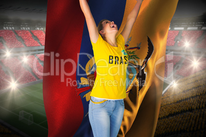 Excited football fan in brasil tshirt holding ecuador flag