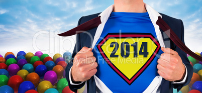 Composite image of businessman opening shirt in superhero style