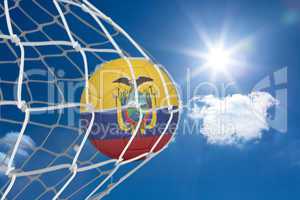 Football in ecuador colours at back of net