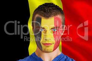 Serious young belgium fan with facepaint