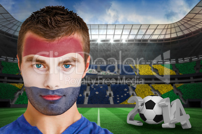 Serious young russia fan with face paint