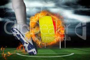 Football player kicking flaming belgium flag ball