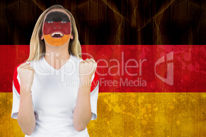 Excited german fan in face paint cheering