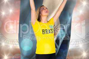 Excited football fan in brasil tshirt holding argentina flag