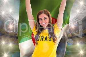 Pretty football fan in brasil t-shirt holding algeria flag