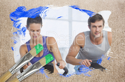 Composite image of couple working out in gym