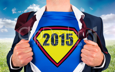 Composite image of businessman opening shirt in superhero style