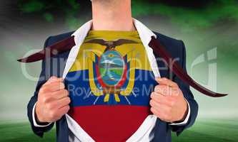 Businessman opening shirt to reveal ecuador flag