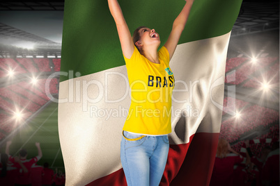 Excited football fan in brasil tshirt holding italy flag