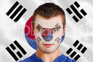 Serious young football fan in face paint