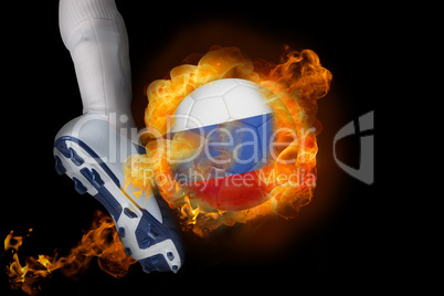 Football player kicking flaming russia ball
