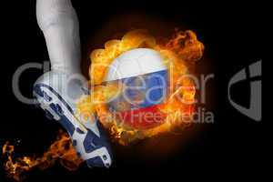 Football player kicking flaming russia ball