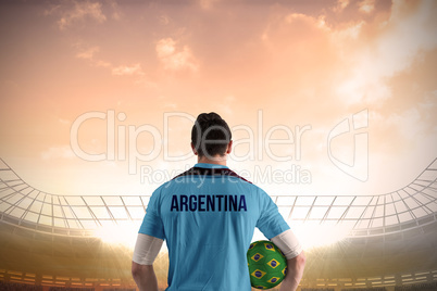 Argentina football player holding ball