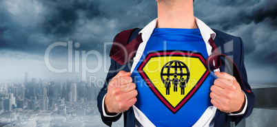 Composite image of businessman opening shirt in superhero style