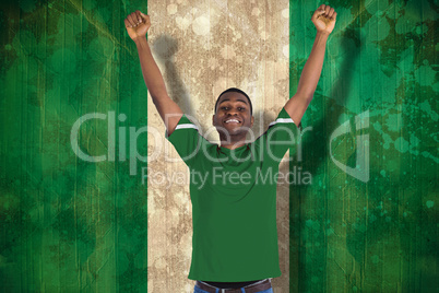 Cheering football fan in green jersey