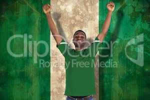 Cheering football fan in green jersey