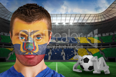 Serious young ecuador fan with face paint