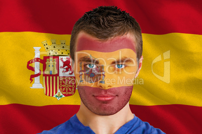 Serious young spain fan with facepaint
