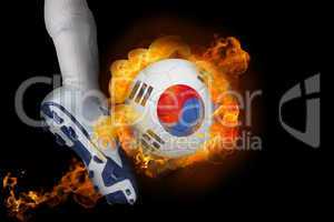 Football player kicking flaming korea republic ball