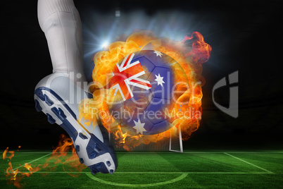 Football player kicking flaming australia flag ball