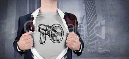 Composite image of businessman opening shirt in superhero style