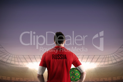Russia football player holding ball