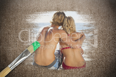 Composite image of couple on the beach