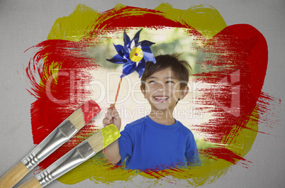 Composite image of little boy with pinwheel