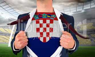 Businessman opening shirt to reveal croatia flag