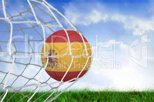 Football in spain colours at back of net