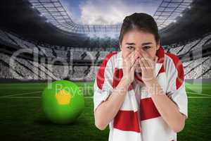 Nervous football fan looking ahead