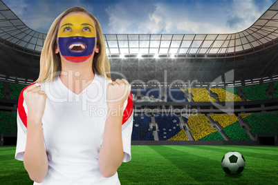 Excited colombia fan in face paint cheering