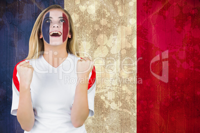 Excited france fan in face paint cheering