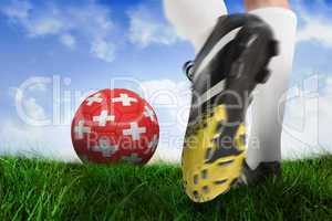 Football boot kicking switzerland ball