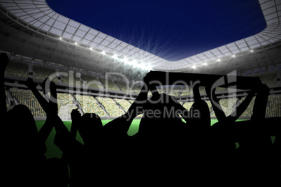 Silhouettes of football supporters