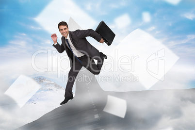 Composite image of cheerful businessman in a hurry