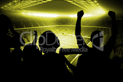 Silhouettes of football supporters