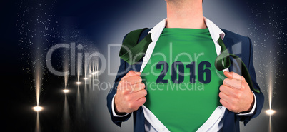 Composite image of businessman opening shirt in superhero style