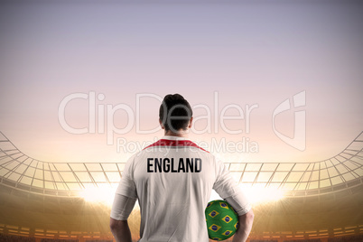 England football player holding ball