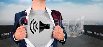 Composite image of businessman opening shirt in superhero style